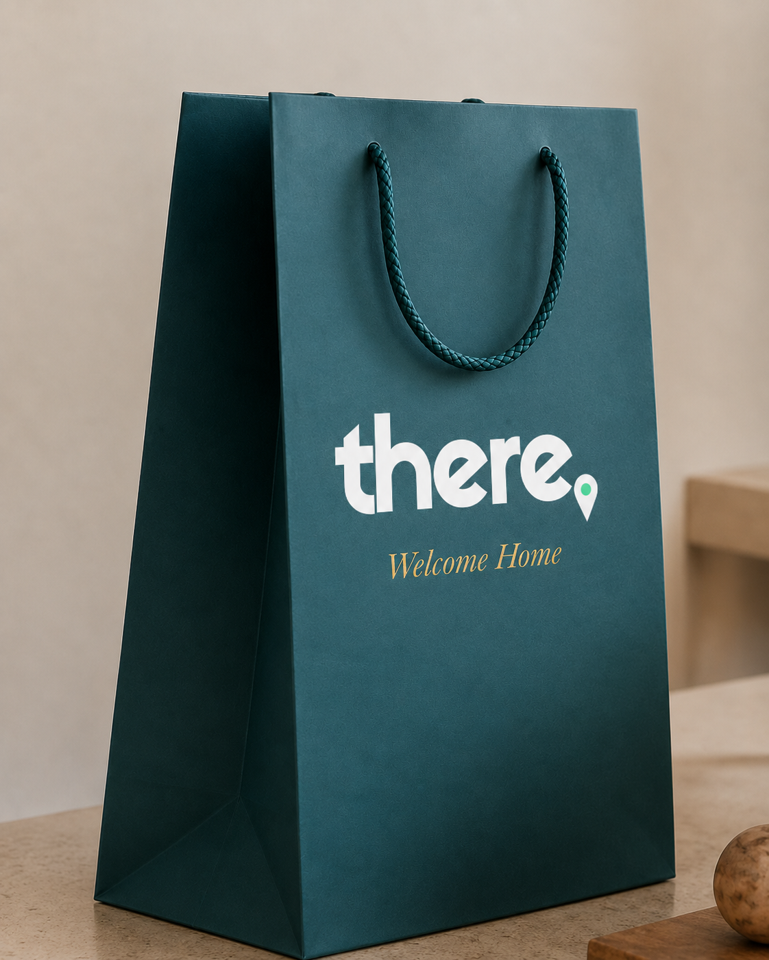 The green There Welcome Home gift bag used for the Home Run package