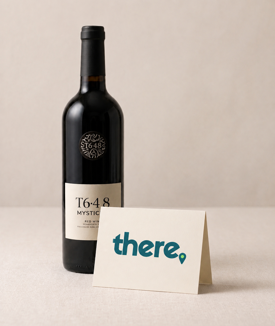 A bottle of kosher wine with a personalised THERE card